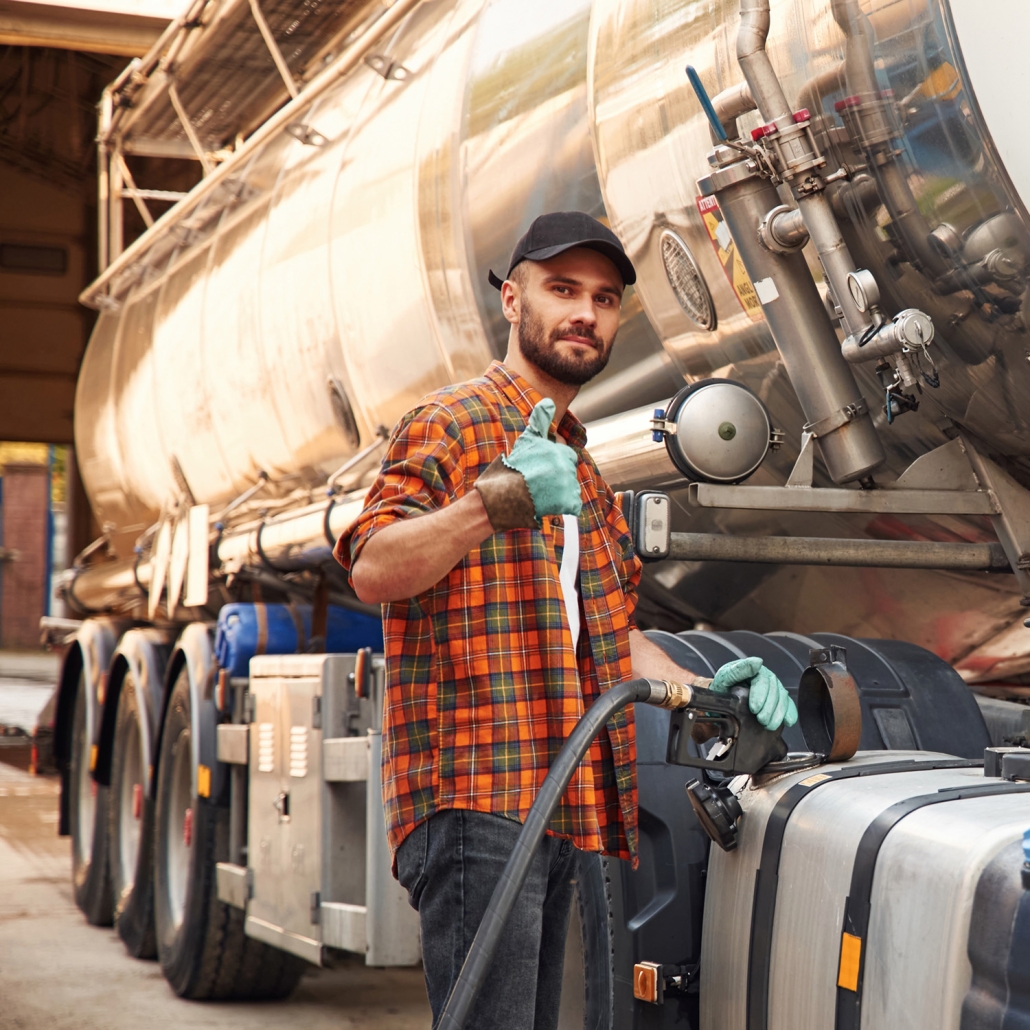 driver at truck with thumbs up