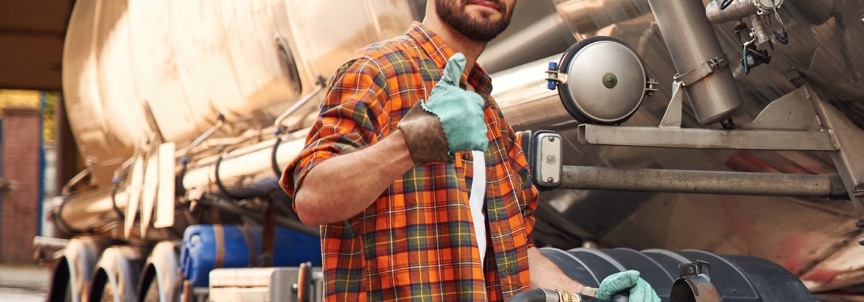 driver at truck with thumbs up