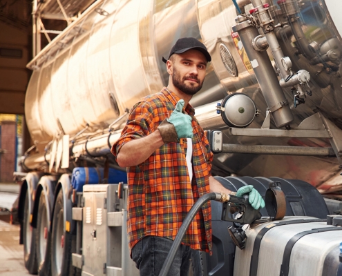 driver at truck with thumbs up