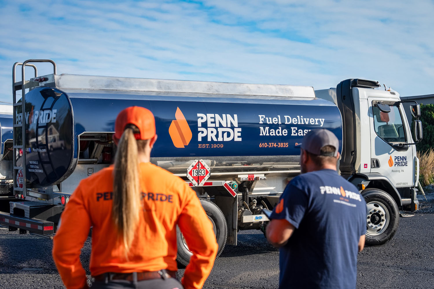 employees looking at fuel truck