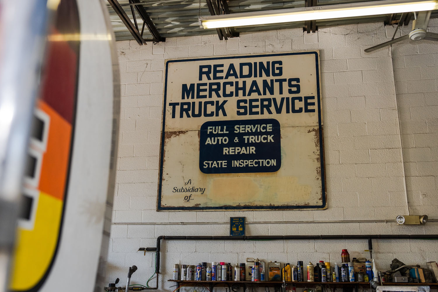 vintage signage hanging in a work shop